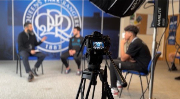 Filming interview at Queens Park Rangers football club with professional lighting
