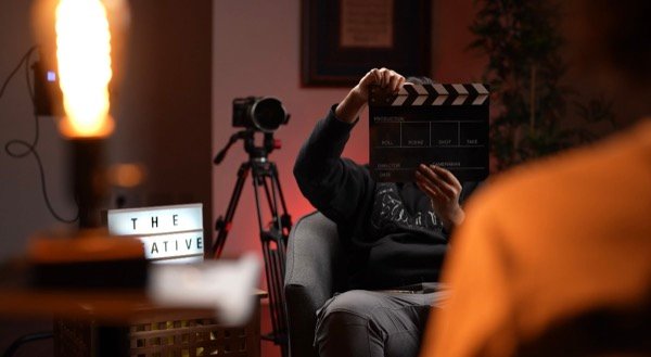 Using clapperboard on set during cinematic film production