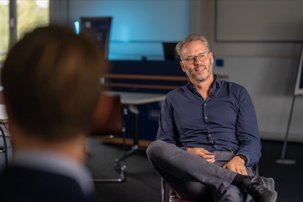 Filming corporate interview in modern office environment